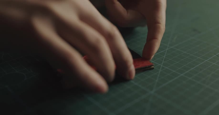 A person is making their own wallet
