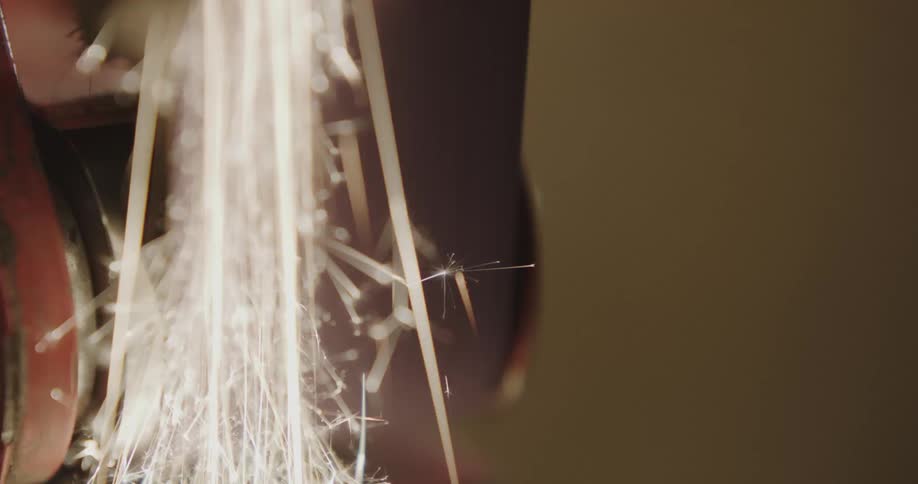 A mechanical sanding belt with sparks