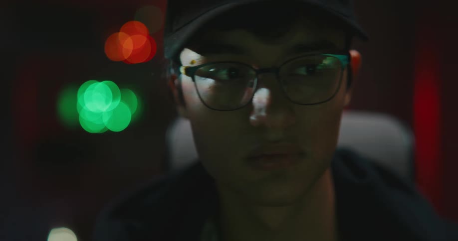 A man is looking around while wearing glasses