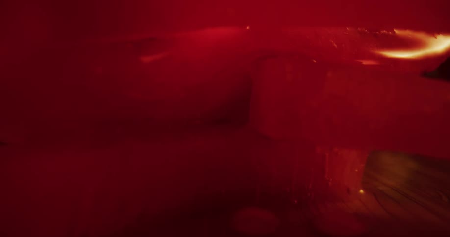 Red white and brown colors that look like tomatoes and dripping water