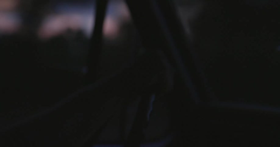 White man driving his car alone at dusk