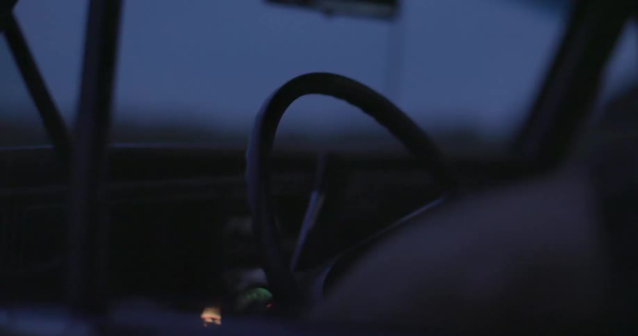 A person driving a car at night