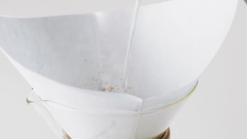 Water pouring into a pour over coffee maker
