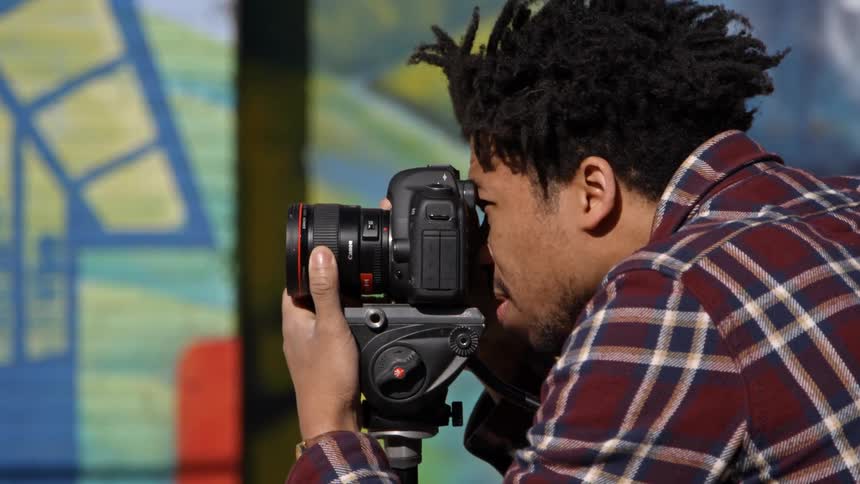 A man taking photographs on a sunny day