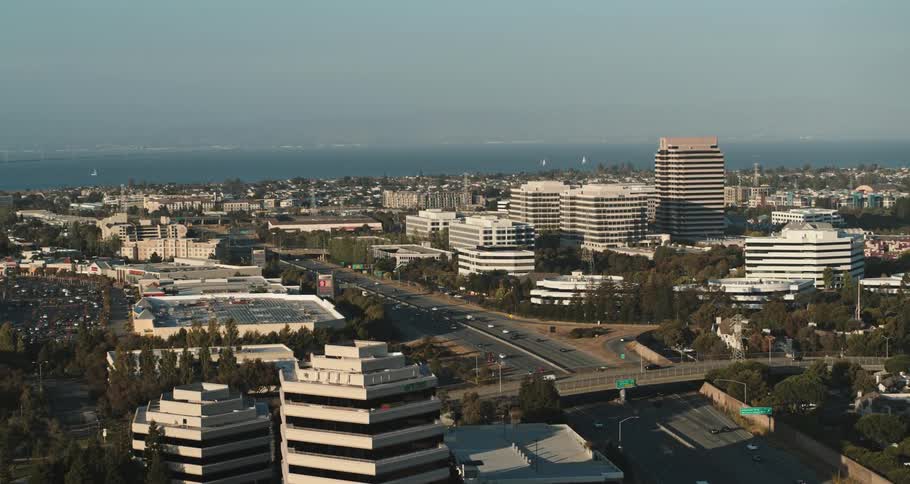 Vehicles travel on the freeway going through the city