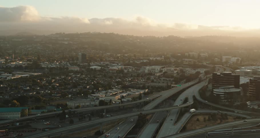 Busy city with many cars on the highways on a cloudy day