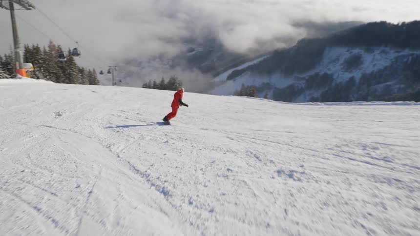 A person snowboarding down a hill