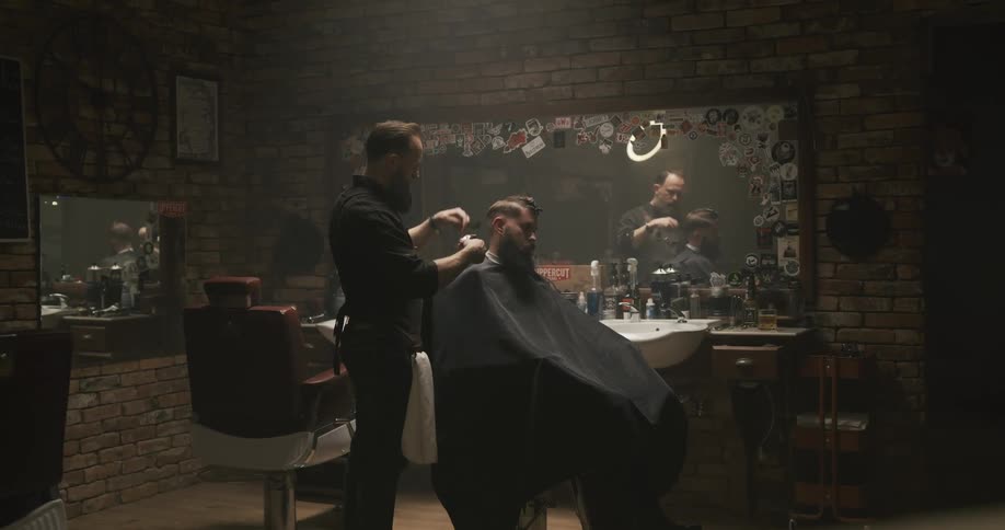 A person is getting a haircut in a salon