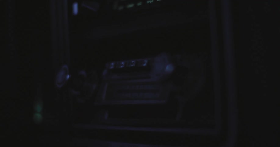 A car radio with dials and buttons and lights blinking