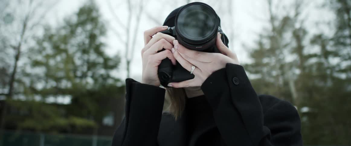 A woman using a camera