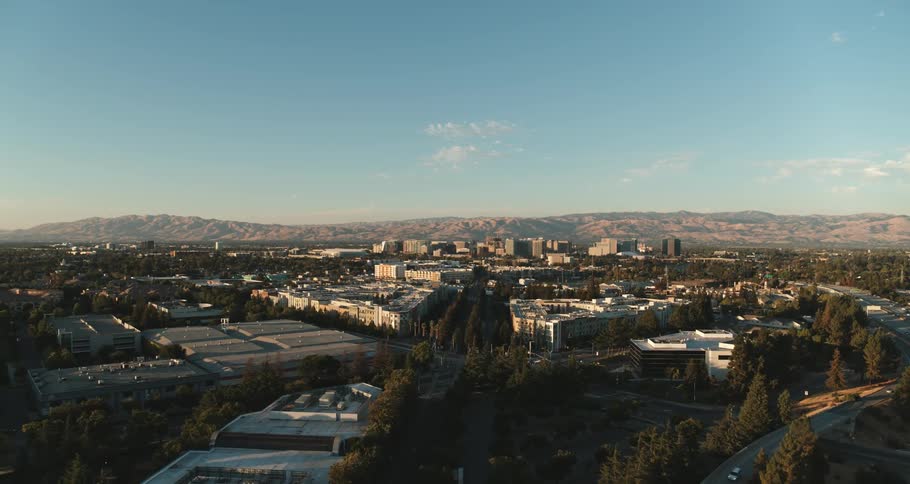 Medium city from above with mountains at the background