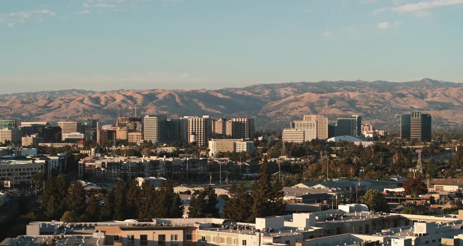 Midsized city with mountains at the background