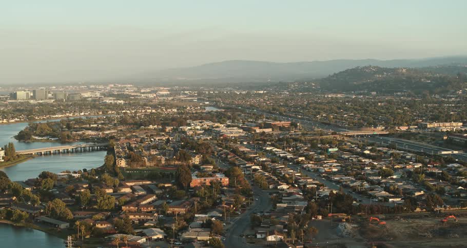 The bridge runs on the side of the city