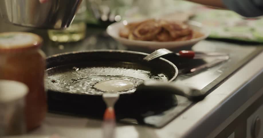 A person cooking a pancake