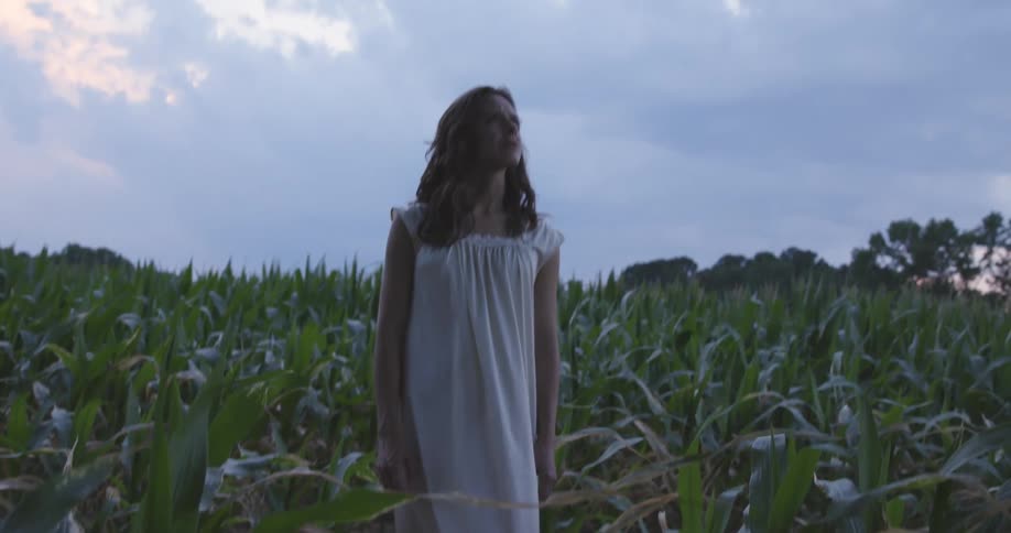 A woman standing in a field