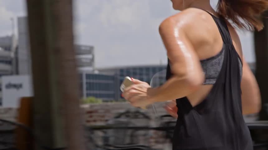 A woman jogs down the road