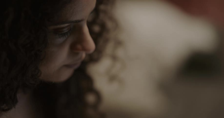 A woman in a room talking
