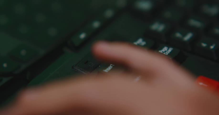 Person is typing on a keyboard