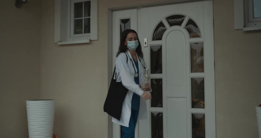 A doctor exits through the door