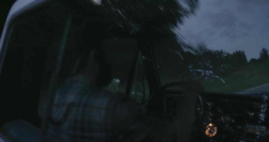 White man driving his car at a residential neighborhood alone