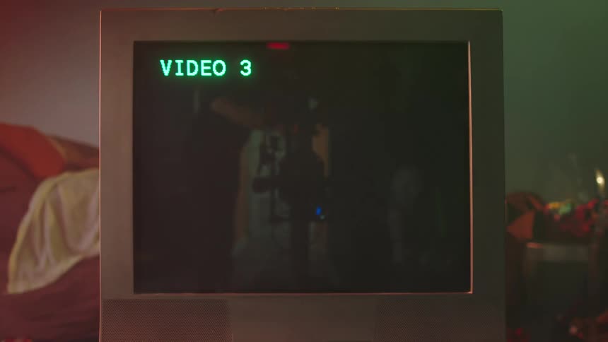 A camera mans reflection is seen in the television screen