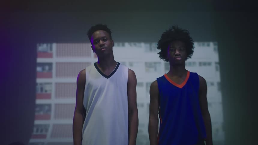 Two teenagers standing in front of a projection