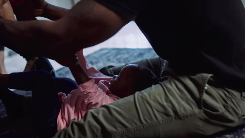 Children playing with their father