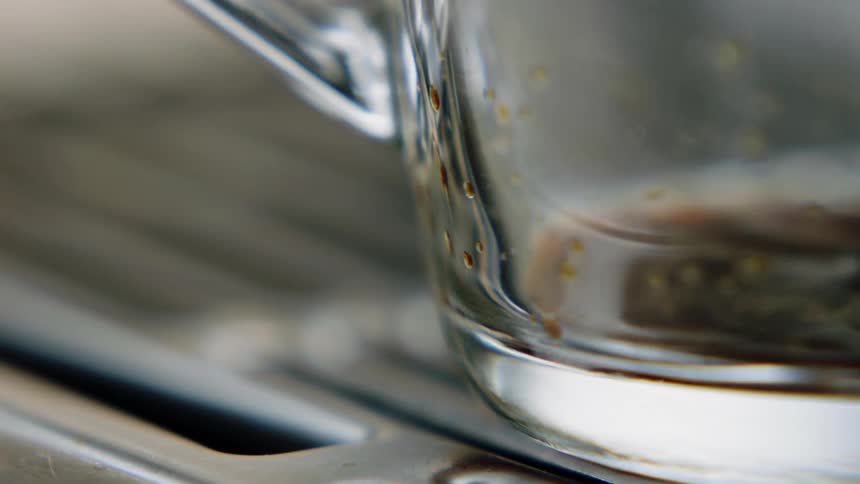 A view of coffee filling a cup