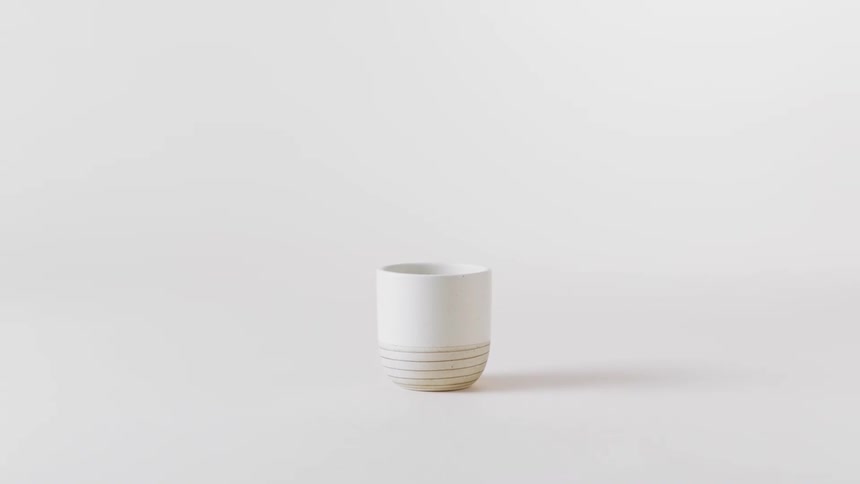 White porcelain cup with yellow stripes