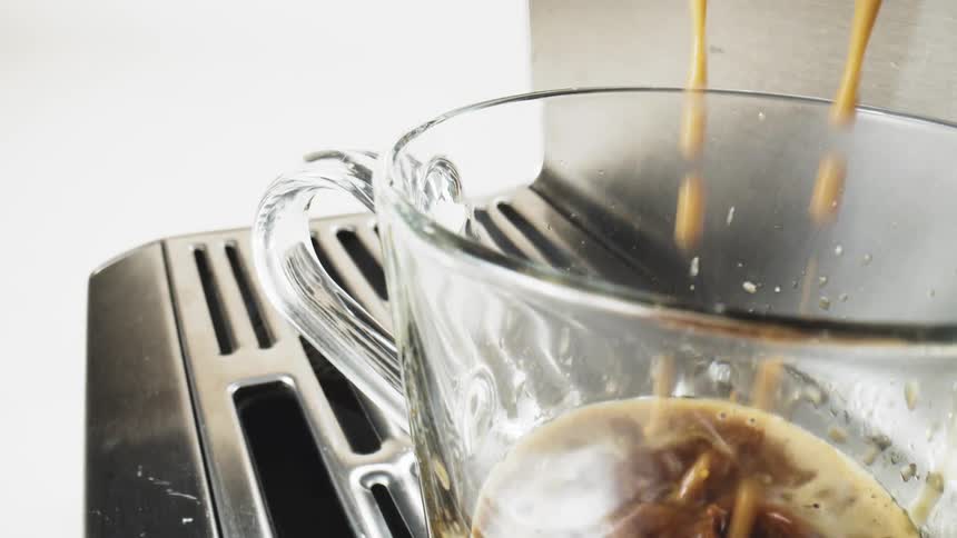A close up of a coffee machine brewing coffee