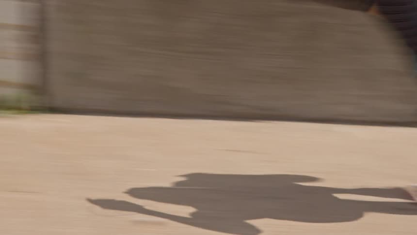 A woman jogs on a sidewalk