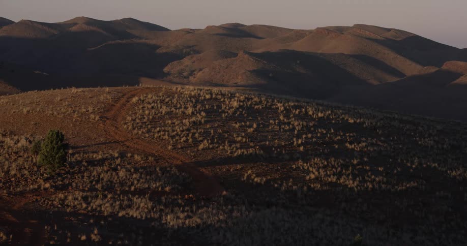 A wide shot of a hill trail