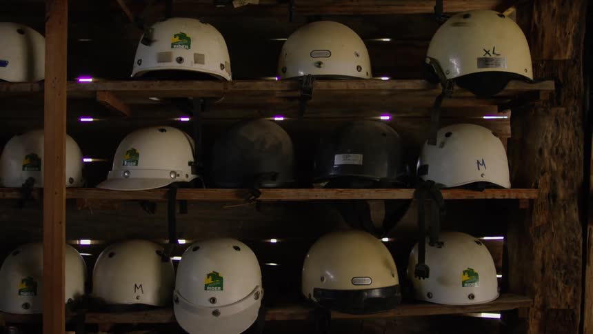 The shelves are lined with helmets