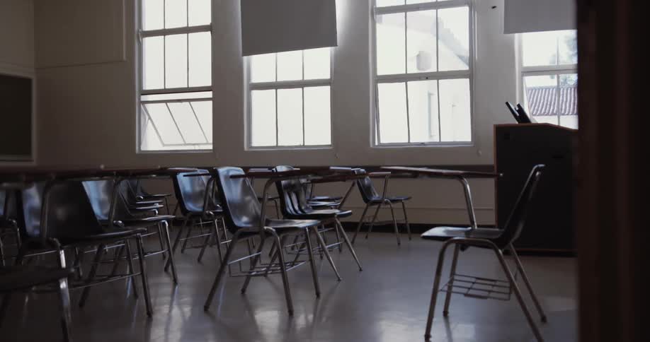 A classroom is empty besides desks