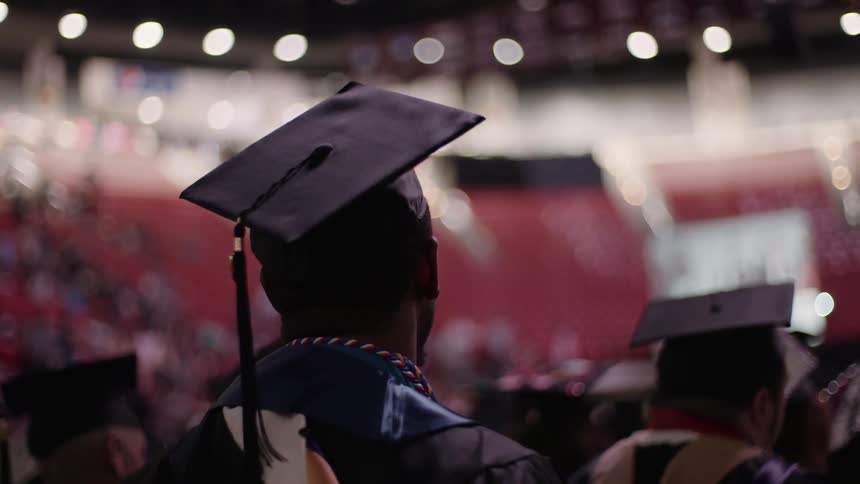 Graduates sit during their graduation ceremony
