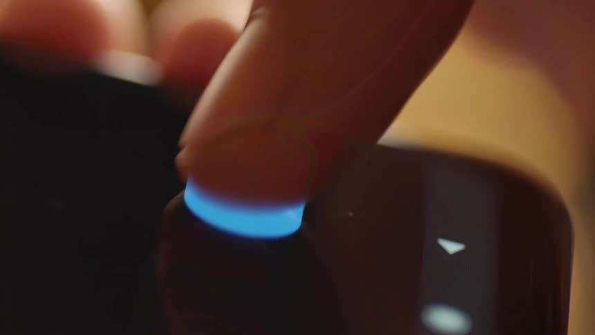 Macro cinematic close-up of a finger tapping the blue “Send” button on smartphone screen. Filmed in soft warm light indoors, perfect for communication, messaging, UX/UI design, app interface, and modern digital technology projects.