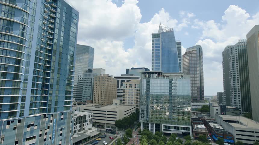 An aerial view of tall skyscrapers in a large city in the daytime