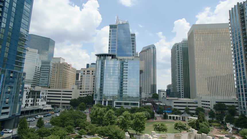 A green city park at the base of skyscrapers