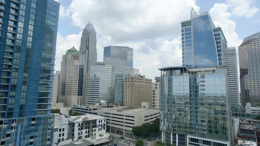Flying through a city with a lot of tall buildings