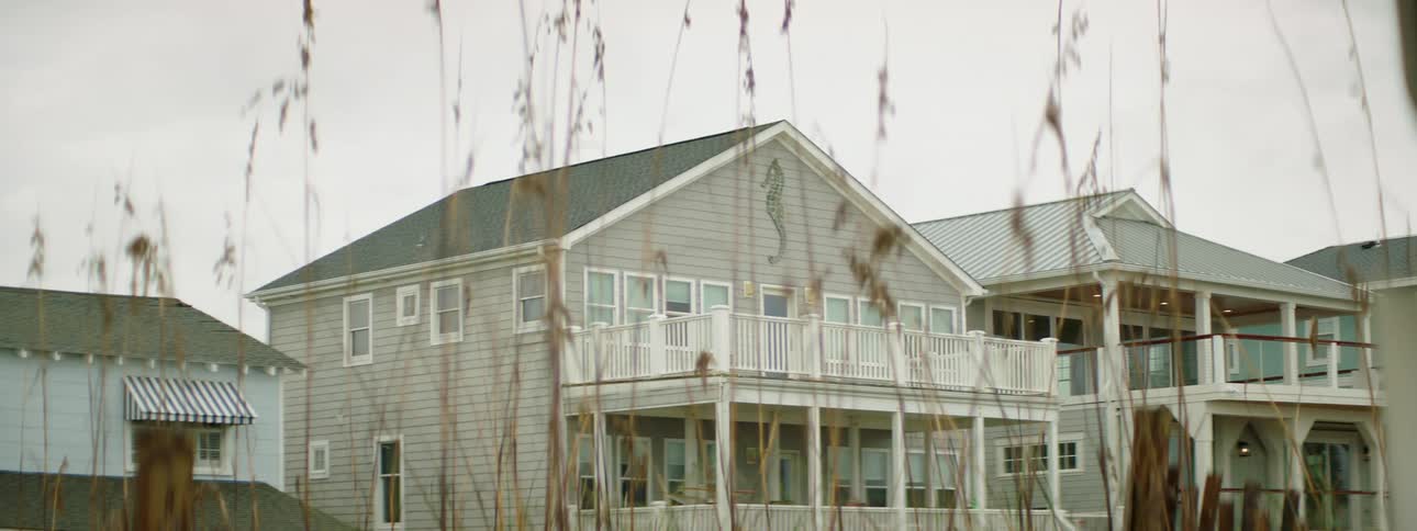 Several two story homes with nice patios are standing side by side