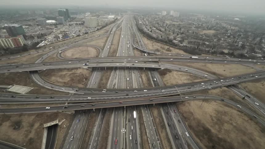 Aerial view of vehicles driving on a busy freeway system