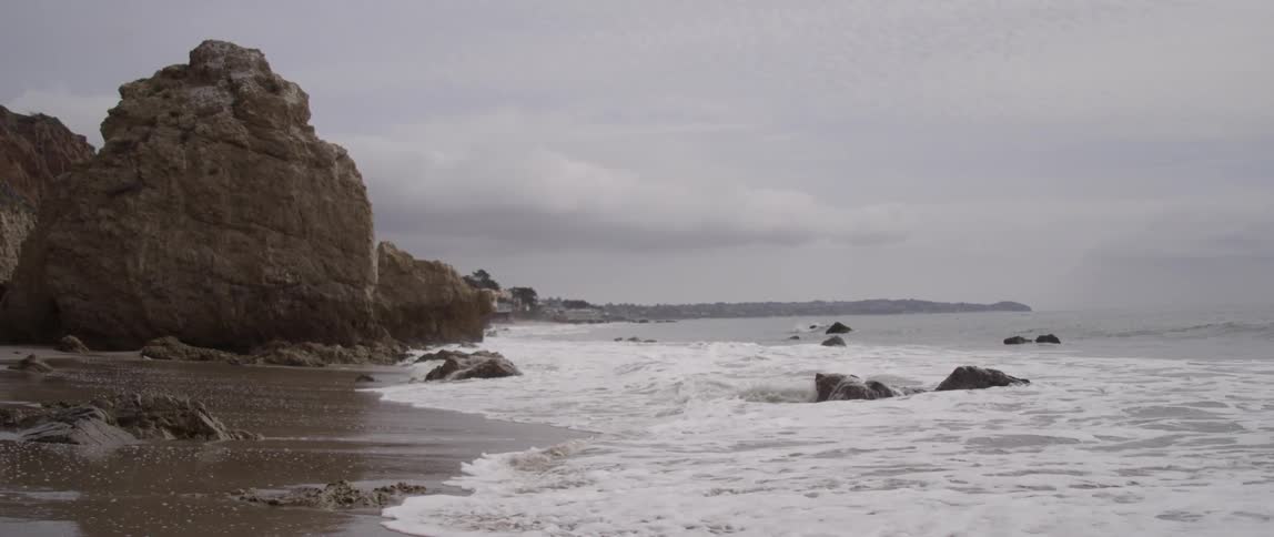 Waves coming ashore on a rocky beach