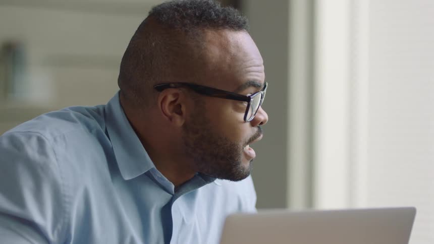 A male employee in a business meeting