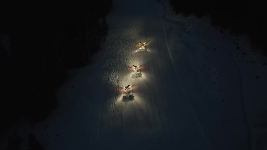Cars are driving at night in winter