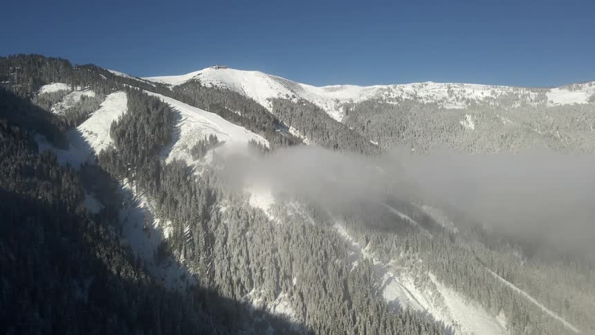 Fog is sitting on the mountain slope