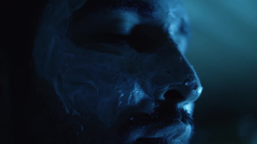 A man has facial cream all over his face