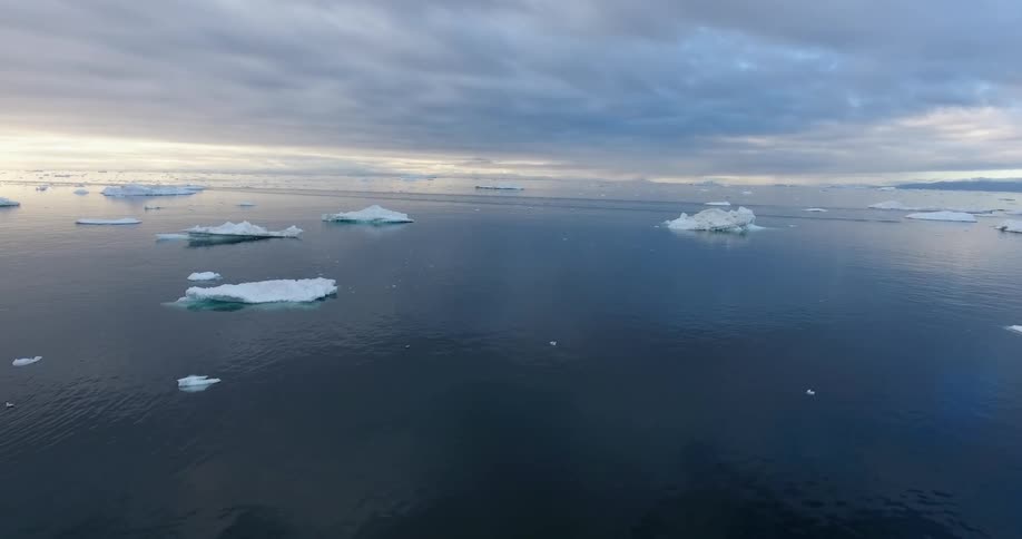 Heavy clouds cover the iceberg filled ocean
