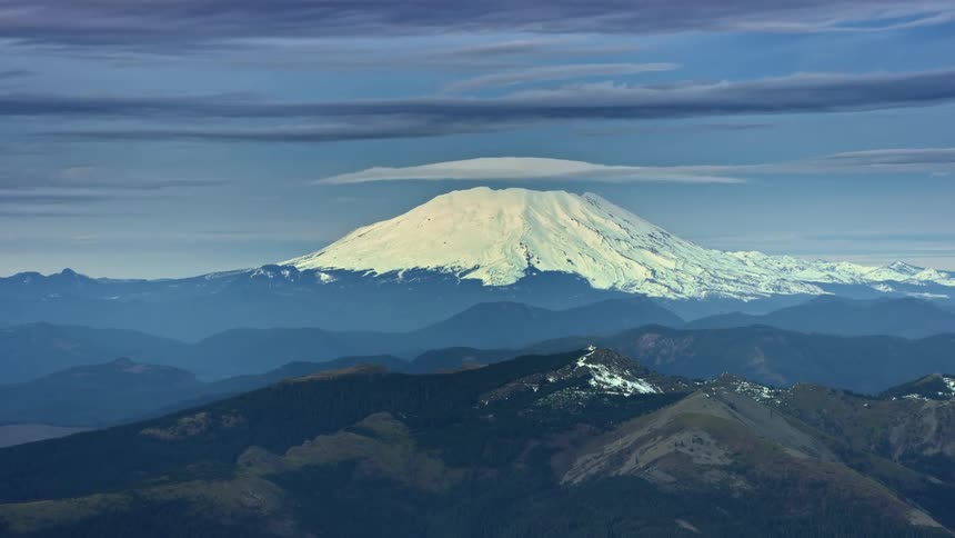 Mount St Helens in Washington State in the Pacific Northwest Cascade Mountains rises high above with lenticular clouds above