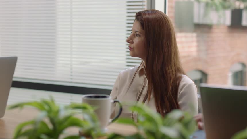 A woman listening and responding during a meeting