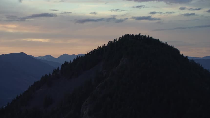 Looking north at Wind Mountain and the Gifford Pinchot National Forest in southen Washington along the Columbia River at sunset in this aerial shot